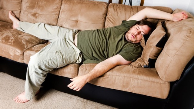 Lazy guy flung all over the couch