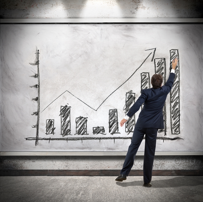 Businessman shows economic growth