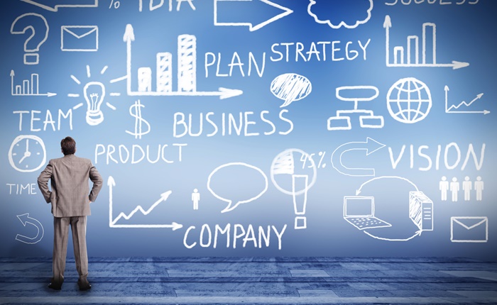 Businessman looking at Innovation plan.