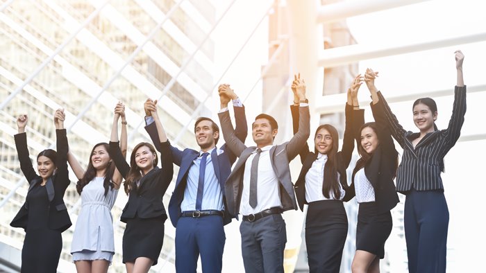 Business People Celebrating with arm raised up.